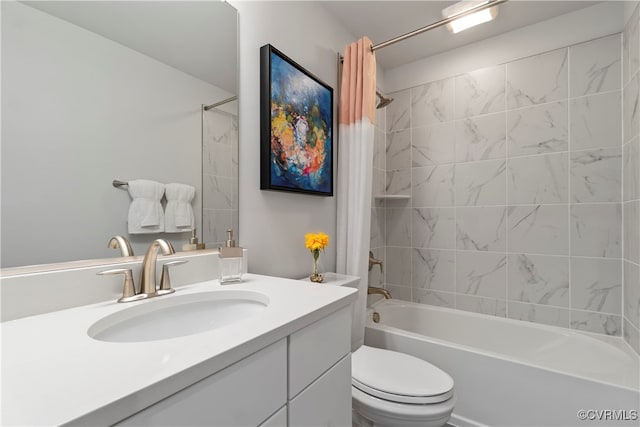 full bathroom featuring vanity, shower / tub combo with curtain, and toilet