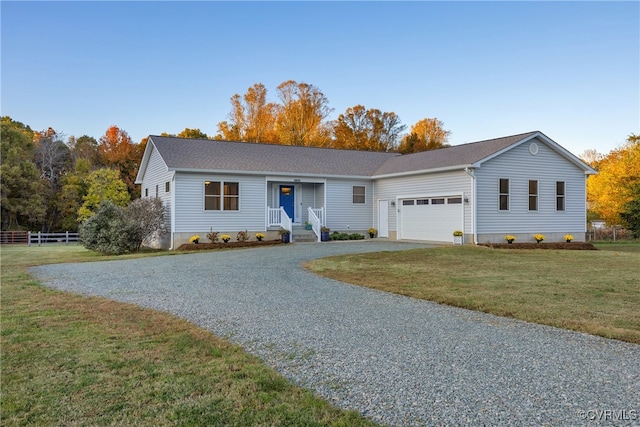 ranch-style house with a front lawn and a garage