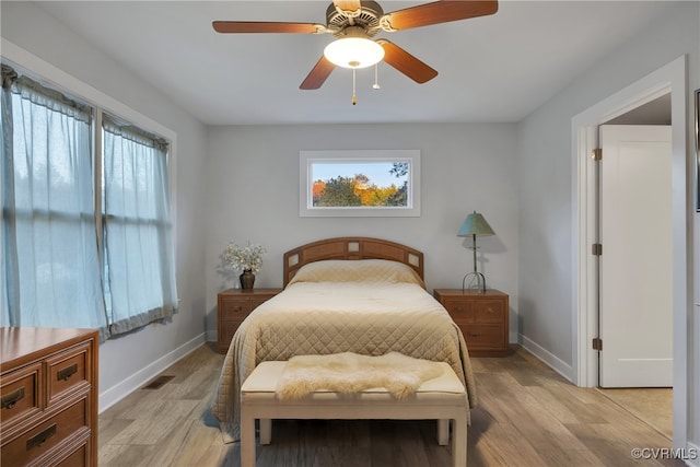 bedroom featuring light hardwood / wood-style floors and ceiling fan