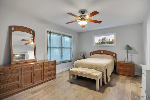 bedroom with light wood-type flooring and ceiling fan