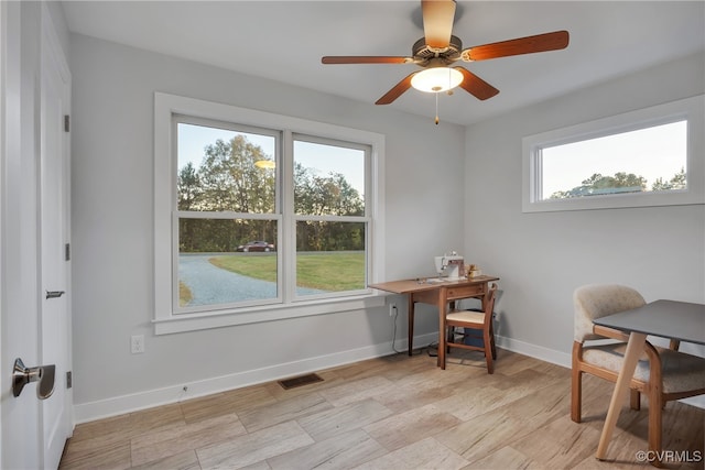 office space with a wealth of natural light and ceiling fan