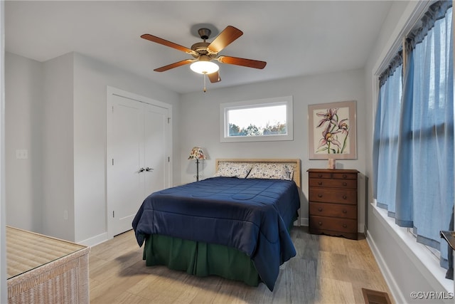 bedroom featuring light hardwood / wood-style flooring and ceiling fan