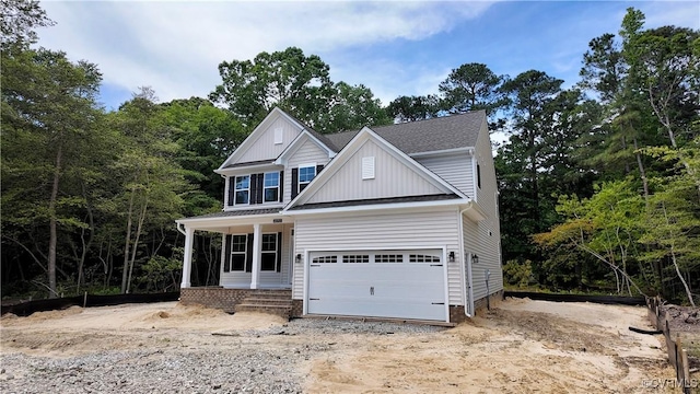 2050 Swiss Ln, Hayes, VA 23072 - view of front of home featuring a garage and board and batten siding