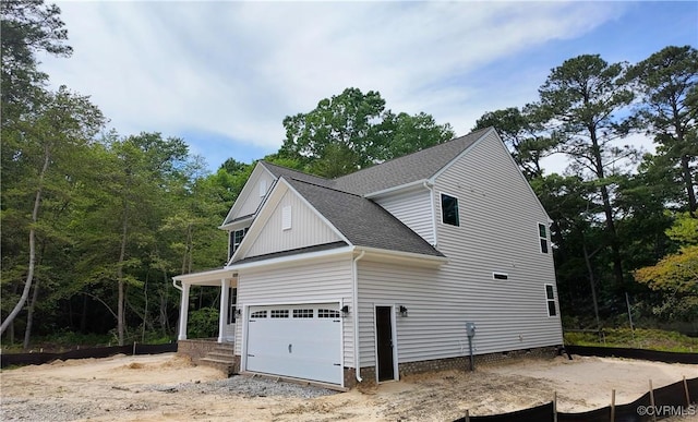 2050 Swiss Ln, Hayes, VA 23072 - view of property exterior featuring roof with shingles, an attached garage, and crawl space