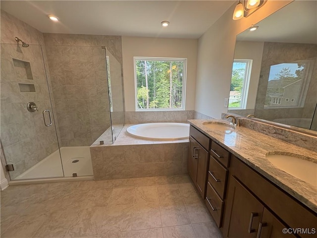 2050 Swiss Ln, Hayes, VA 23072 - bathroom with healthy amount of natural light, a garden tub, a stall shower, double vanity, and recessed lighting