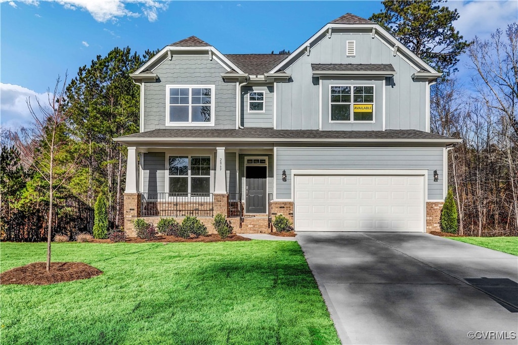 craftsman-style house with a garage, a porch, and a front lawn