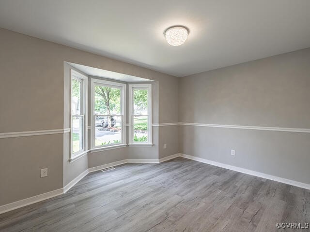 1307 Pritchard Ter, Chesterfield, VA 23235 - unfurnished room with wood finished floors and baseboards