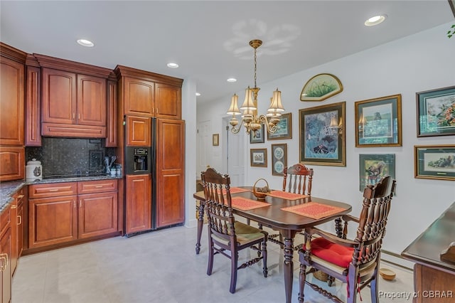 dining space featuring a chandelier