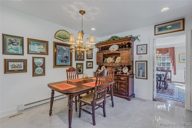 dining area with light tile patterned floors, an inviting chandelier, and baseboard heating