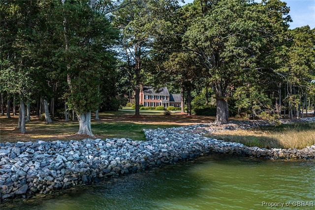 surrounding community featuring a water view