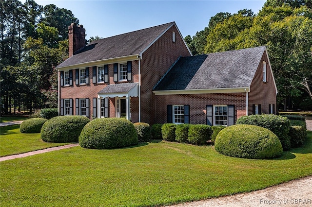 colonial home with a front yard