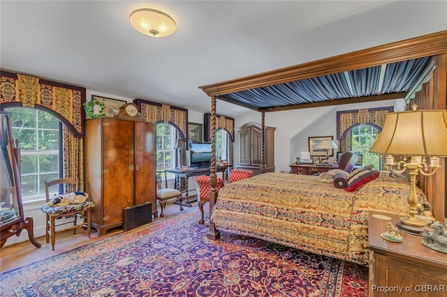 bedroom with hardwood / wood-style flooring