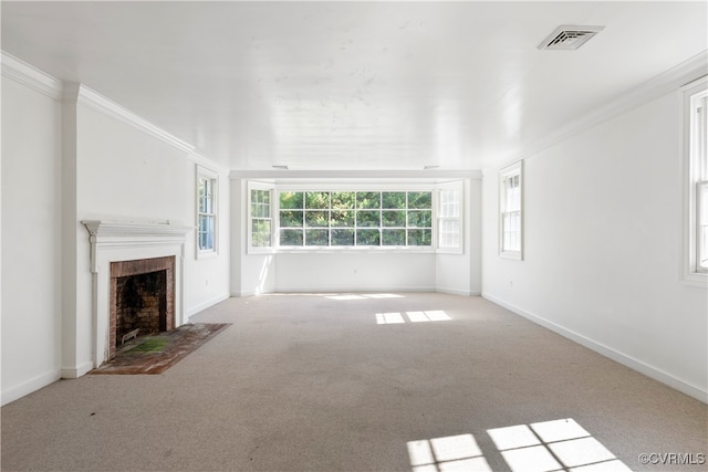 unfurnished living room with crown molding and light colored carpet