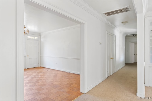 hall featuring crown molding and light colored carpet