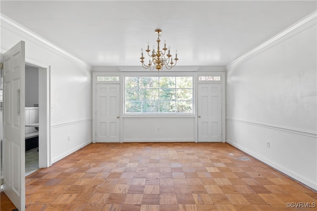 unfurnished room with ornamental molding, a chandelier, and light parquet flooring