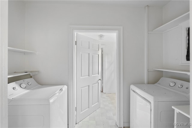 laundry room with washing machine and clothes dryer