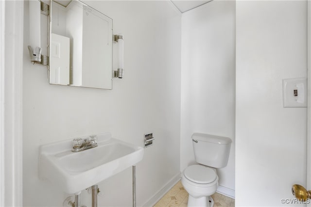 bathroom with toilet and sink