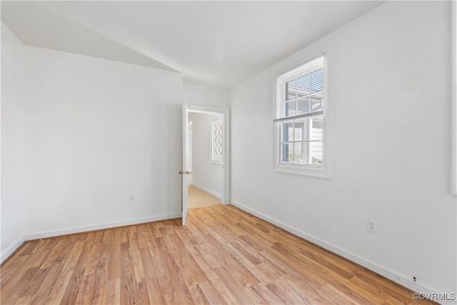 unfurnished room with light wood-type flooring