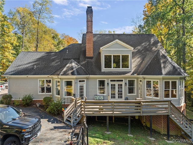 rear view of house featuring a deck