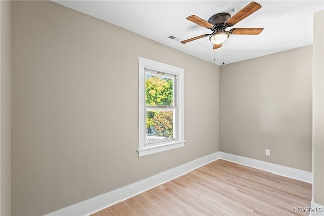 empty room featuring ceiling fan and light hardwood / wood-style floors