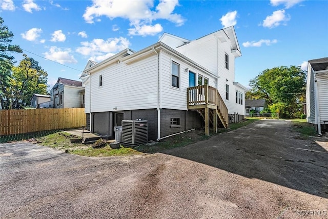 back of property with central air condition unit