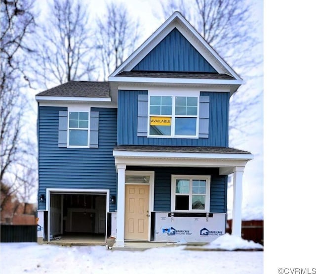 view of front of property with a garage