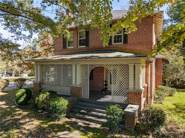 view of front of property featuring covered porch