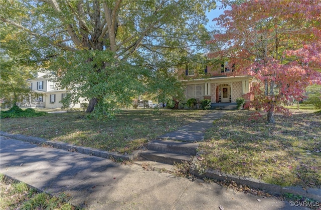 view of front of house featuring a porch and a front lawn