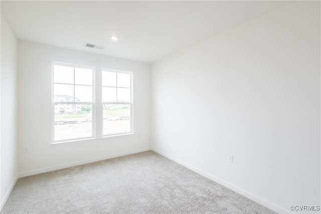 carpeted empty room featuring a healthy amount of sunlight