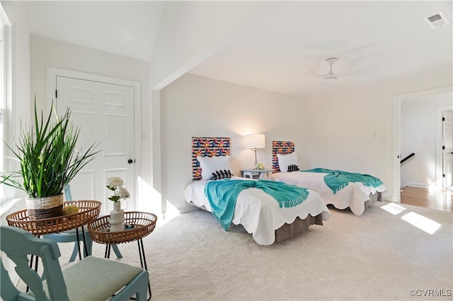 carpeted bedroom featuring ceiling fan