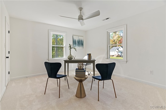 sitting room with light colored carpet and ceiling fan