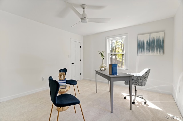 carpeted office with ceiling fan