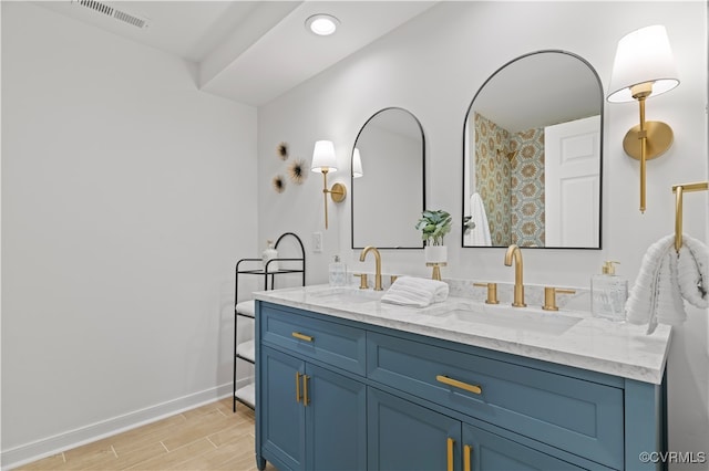 bathroom featuring vanity and wood-type flooring