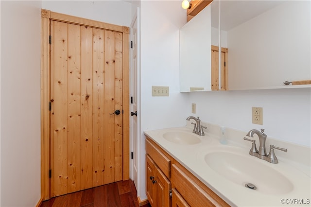 bathroom featuring vanity and hardwood / wood-style floors