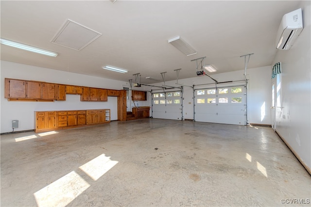 garage featuring a garage door opener and a wall unit AC