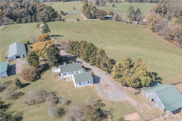 birds eye view of property with a rural view