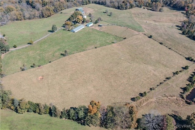 birds eye view of property featuring a rural view