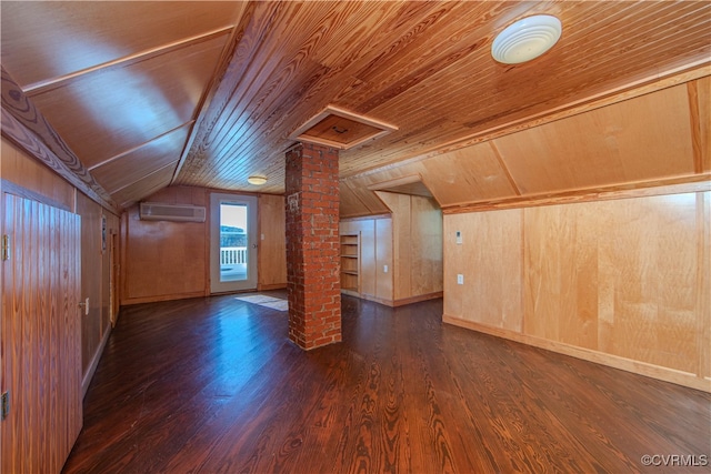 additional living space with wood ceiling, dark hardwood / wood-style floors, wooden walls, and ornate columns