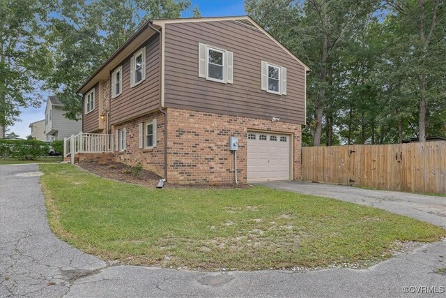 view of property exterior with a yard and a garage