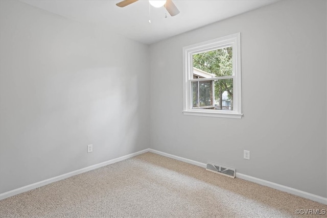 carpeted empty room with ceiling fan