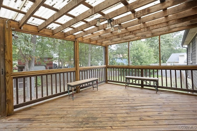 sunroom / solarium featuring vaulted ceiling