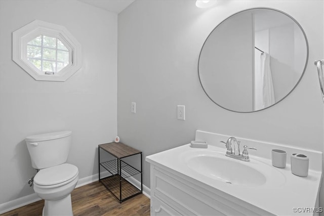 bathroom featuring vanity, a shower with shower curtain, hardwood / wood-style flooring, and toilet