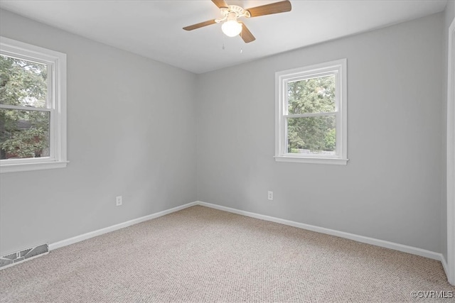 empty room with carpet floors and ceiling fan