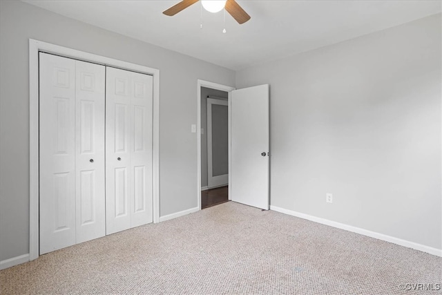 unfurnished bedroom with a closet, ceiling fan, and carpet flooring