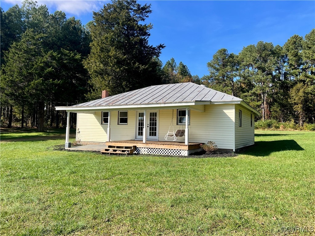 back of house with a yard