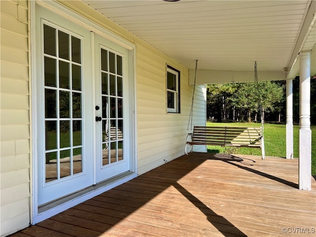 wooden terrace featuring french doors