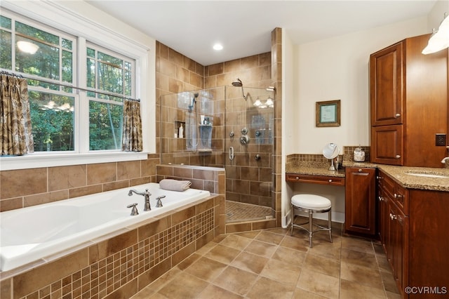 bathroom featuring vanity, separate shower and tub, and tile patterned floors