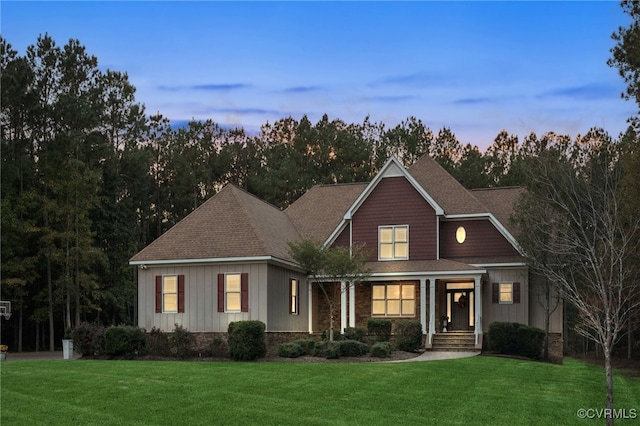 view of front of property with a lawn