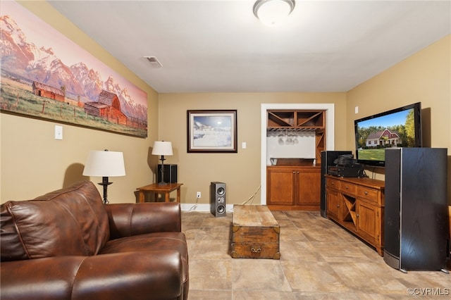 living room featuring bar area