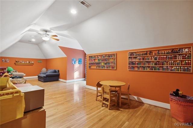 interior space featuring hardwood / wood-style floors, vaulted ceiling, and ceiling fan